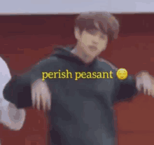 a man in a green hoodie is dancing with the words perish peasant written above him