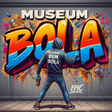 a man is spray painting graffiti on a wall with the words museum bola on it