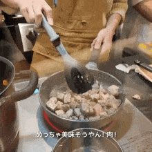 a person is stirring a pot of food with a spatula in a kitchen with chinese writing on the bottom