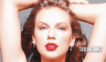 a close up of a woman 's face with taylor swift written on the bottom right