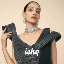 a woman wearing a choker and earrings with the word ishq written on the bottom