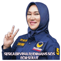 a woman wearing a blue shirt that says seska ervina budimans sos for sulut on it