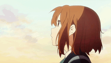 a close up of a girl 's face looking up at the sky