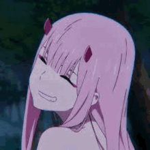 zero two from darling in the franxx is smiling with horns on her head .