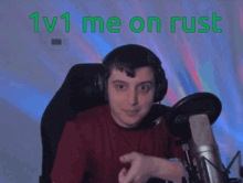 a man sitting in front of a microphone with the words " 1v1 me on rust " on the bottom