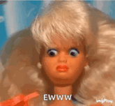 a doll with a surprised look on her face and the words ewww on the bottom