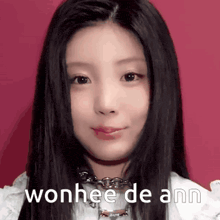 a close up of a woman 's face with the words wonhee de ann written on it