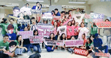 a group of people holding signs for kisses lovers and sweethearts