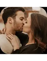 a man and a woman kissing with the woman wearing a ring on her finger