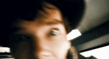 a blurry picture of a person 's face with their eyes closed