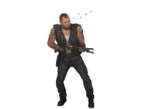 a man is holding a gun in his hand and dancing .