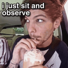 a man sitting in a car eating an ice cream cone with a caption that says i just sit and observe