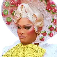 a woman wearing a hat with strawberries on it and a yellow bow tie