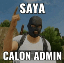 a man wearing a balaclava is pointing up with the words saya calon admin below him