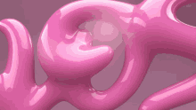 a close up of a pink object that looks like a snake