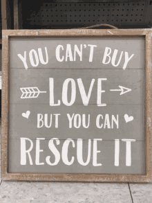 a sign that says you cant buy love but you can rescue it