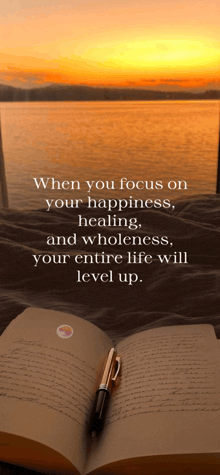 a book is open to a page that says when you focus on your happiness healing wholeness your entire life will level up