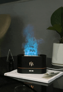 a black box with smoke coming out of it sits on a book titled central