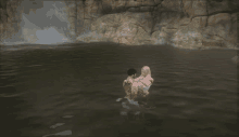 a man and a woman are swimming in a lake with a waterfall in the background