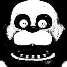 a black and white photo of a monkey 's face with big eyes .