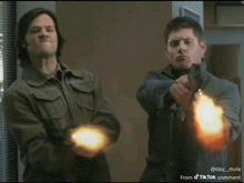 two men are pointing guns at each other and the caption reads from tik tok comment