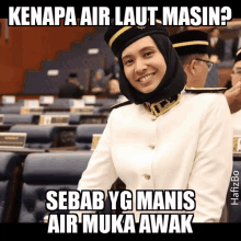 a picture of a woman in a hijab with a caption that says " kenapa air laut mesin "