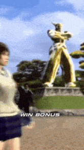 a video game screen shows a woman standing in front of a statue and says win bonus