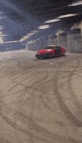 a red car is drifting in a parking garage with smoke coming out of it .