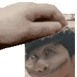 a close up of a person 's face with a hand on it