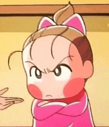 a cartoon baby with a cat ear headband is making a funny face .