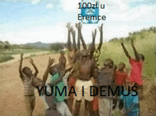 a group of people are standing on a dirt road with their hands in the air and the words yuma i demus on the bottom