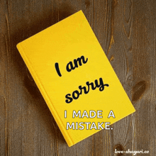 a yellow book that says i am sorry i made a mistake on it