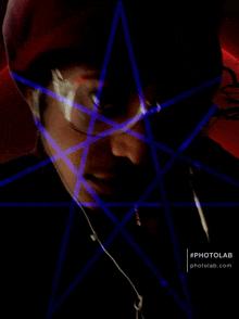 a man 's face is surrounded by a blue and red pentagram