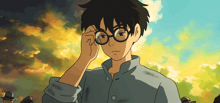 a boy wearing glasses and a blue shirt is looking through his glasses