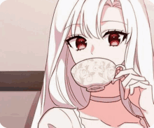 a white haired anime girl with red eyes is drinking from a cup .