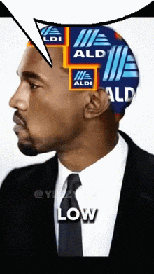 a man in a suit and tie has aldi stickers on his head