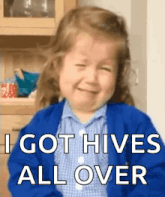 a little girl is crying with the words i got hives all over above her