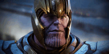 a close up of thanos ' face with a gold helmet on