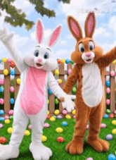 two bunny mascots are standing next to each other in a field of easter eggs