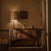 a man in pajamas is standing in front of a dresser