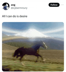 a horse is running in a field with a mountain in the background