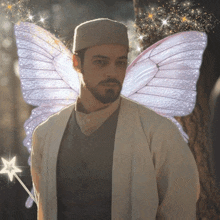 a man with a beard and fairy wings is holding a wand