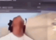 a blurry picture of a person sitting in front of a computer screen
