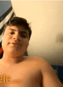 a shirtless man is taking a selfie on omegle.com