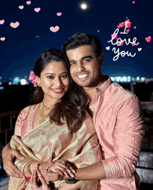 a man and a woman are posing for a picture with the words " i love you " behind them