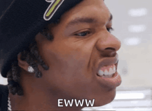 a close up of a man 's face with the word ewww written below it