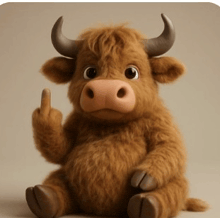 a stuffed bull with horns is sitting down and giving the middle finger