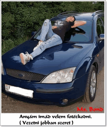 a picture of a woman laying on the hood of a car