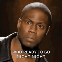 a close up of a man 's face with the words who ready to go night night written on it .