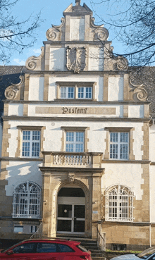 a building with the word postamt on the front